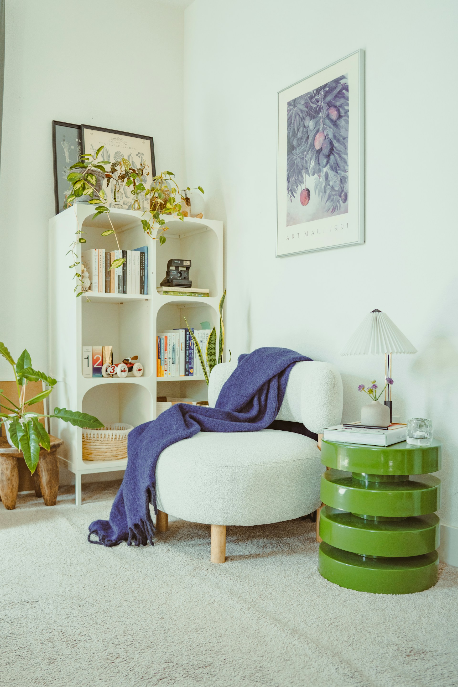 A cozy reading corner with an armchair and bookshelves